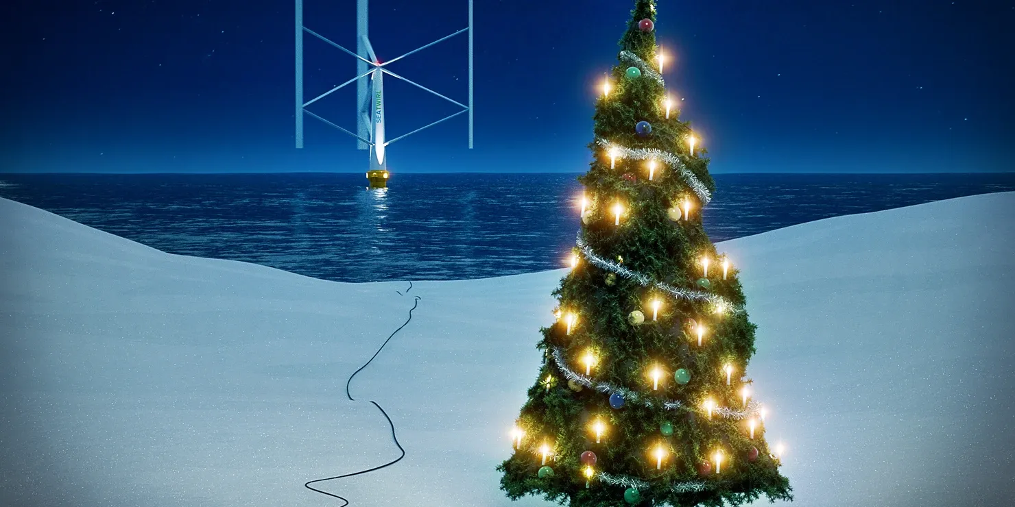 Christmas illustration: a lit Christmas tree in the snow at the water’s edge, with a cable running out to sea to a floating vertical-axis wind turbine