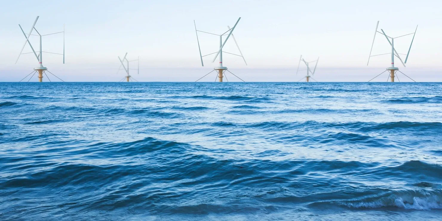 Visualisation of five floating vertical-axis wind turbines on a calm blue sea