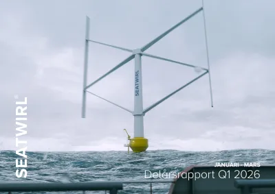 A white vertical-axis wind turbine with a yellow floater in heavy seas under an overcast sky